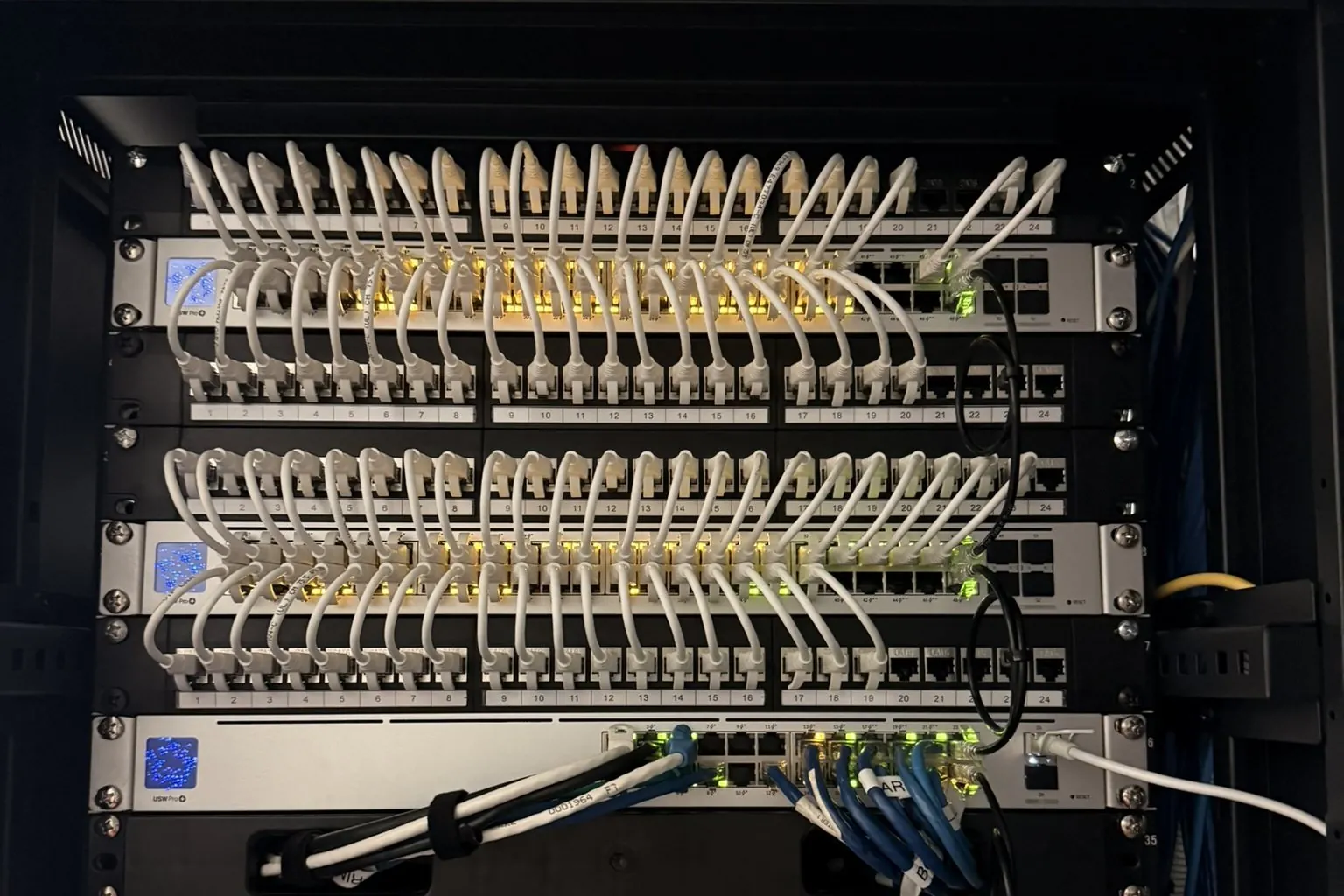 Patch panels and neatly dressed network cabling in a venue comms rack