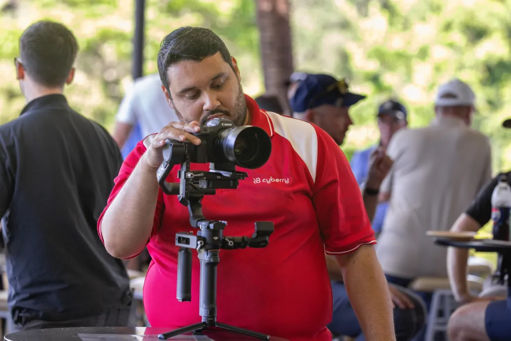 Paull from Cyberry filming on a gimbal at a venue event