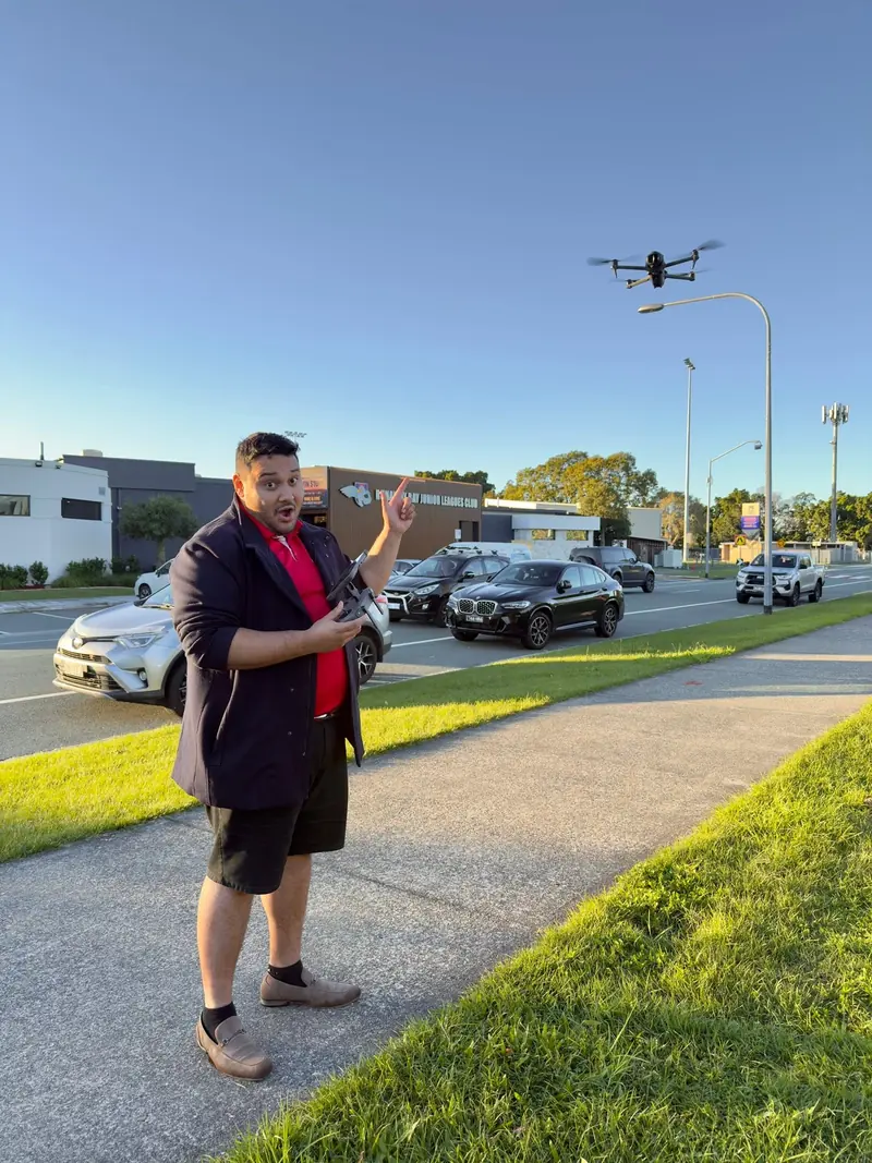 Paull from Cyberry flying a drone on location at golden hour
