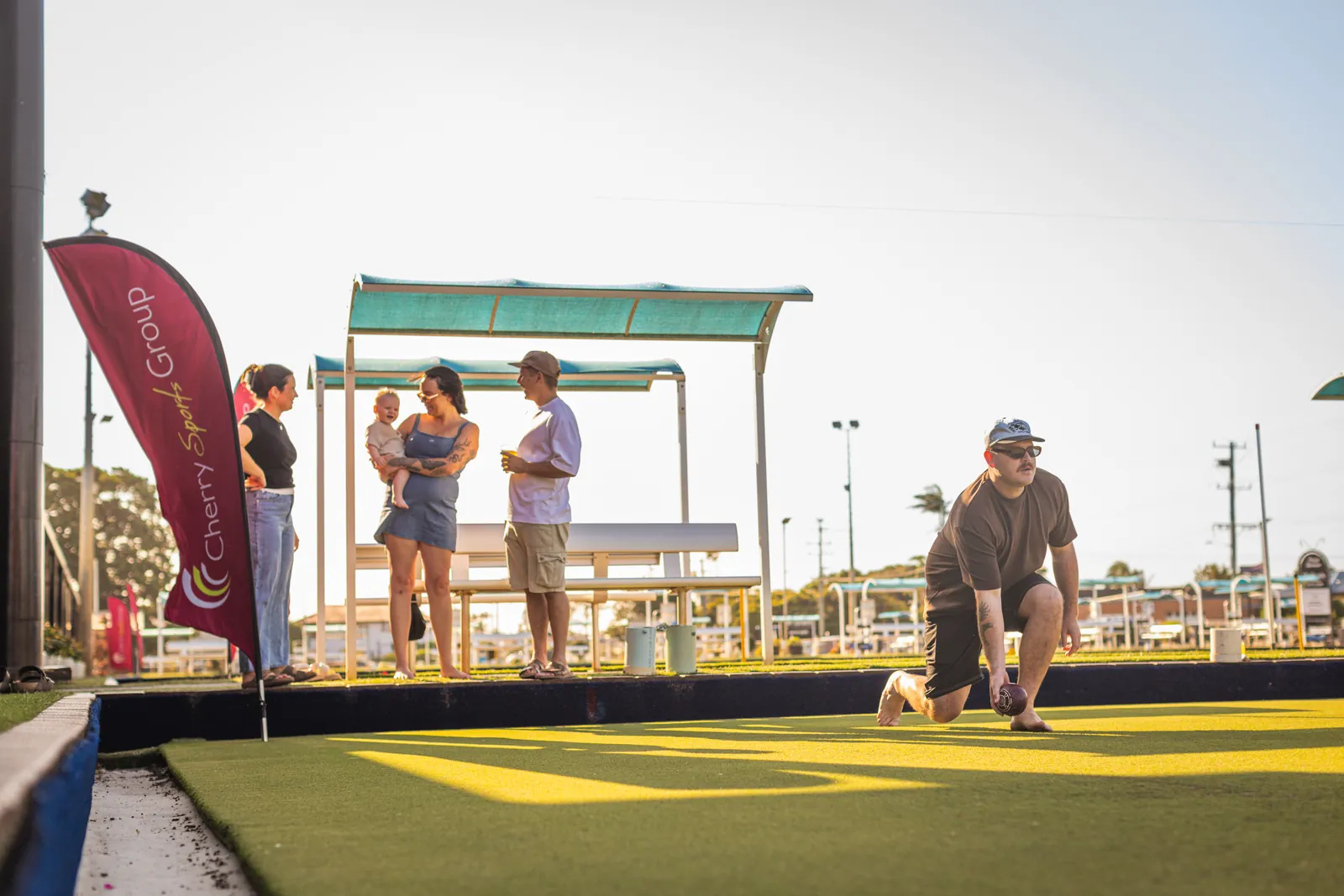 Barefoot bowls at golden hour on the green at Cherry Street Sports
